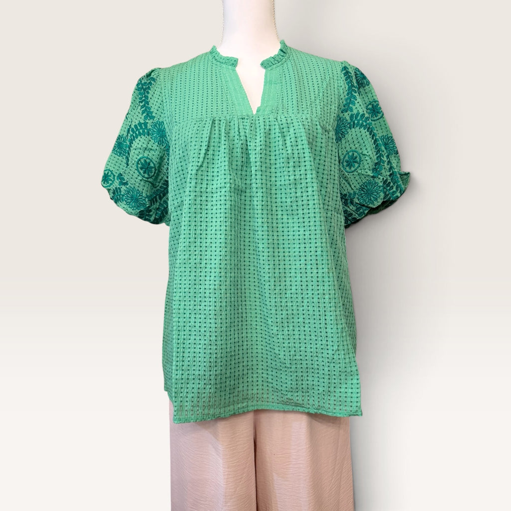 Green embroidered puff-sleeve blouse with textured fabric