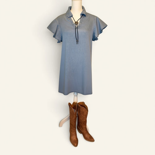 Blue Ridge Denim Dress with ruffle sleeves, concho bolo necklace, and brown Western boots
