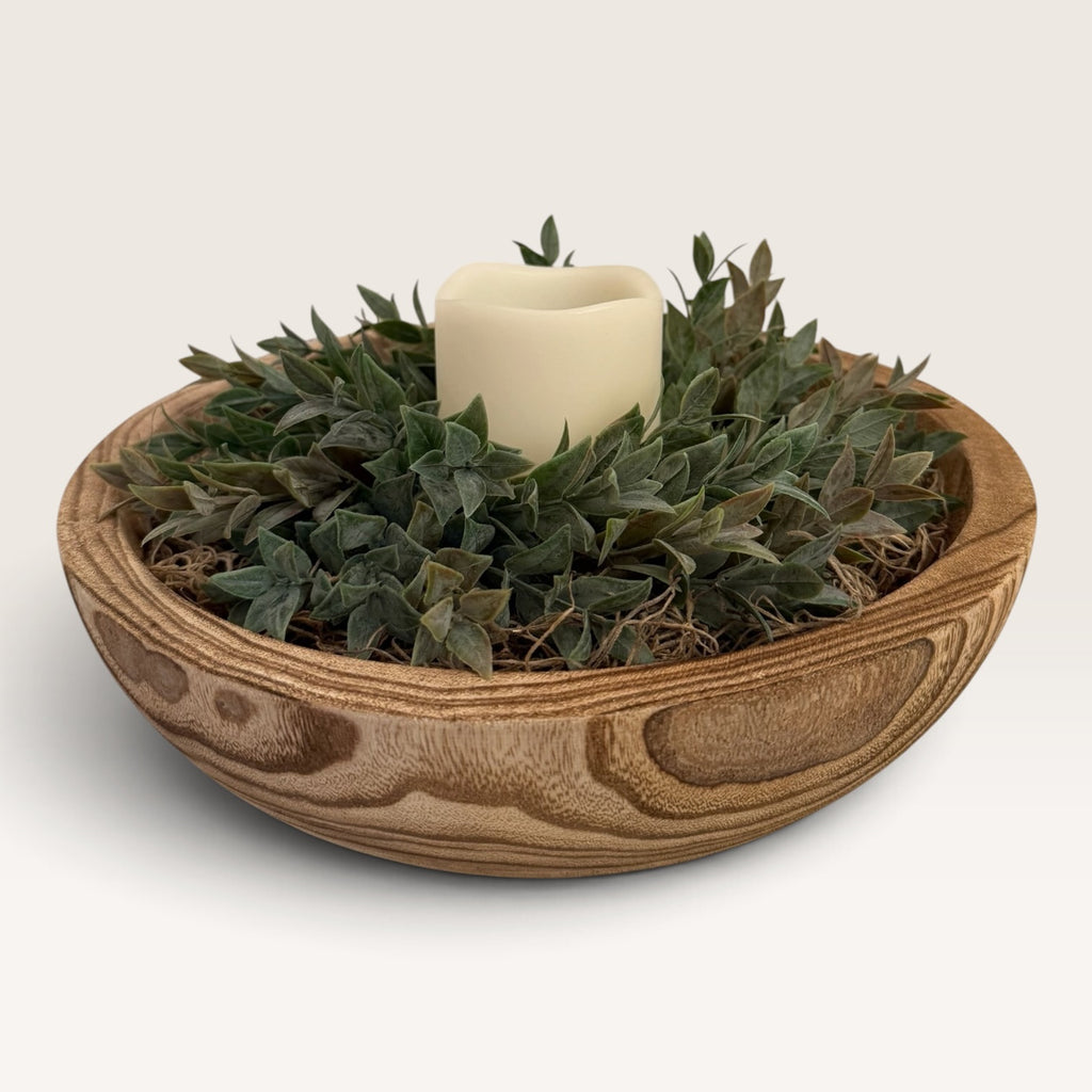 Rustic greenery and flameless candle centerpiece in decorative wood bowl
