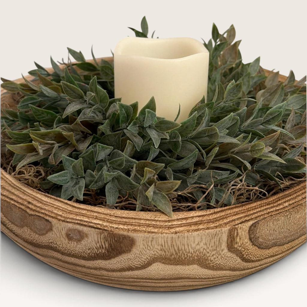 Rustic wood bowl centerpiece with faux greenery and flameless LED pillar candle