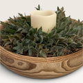 Rustic wood bowl centerpiece with faux greenery and flameless LED pillar candle