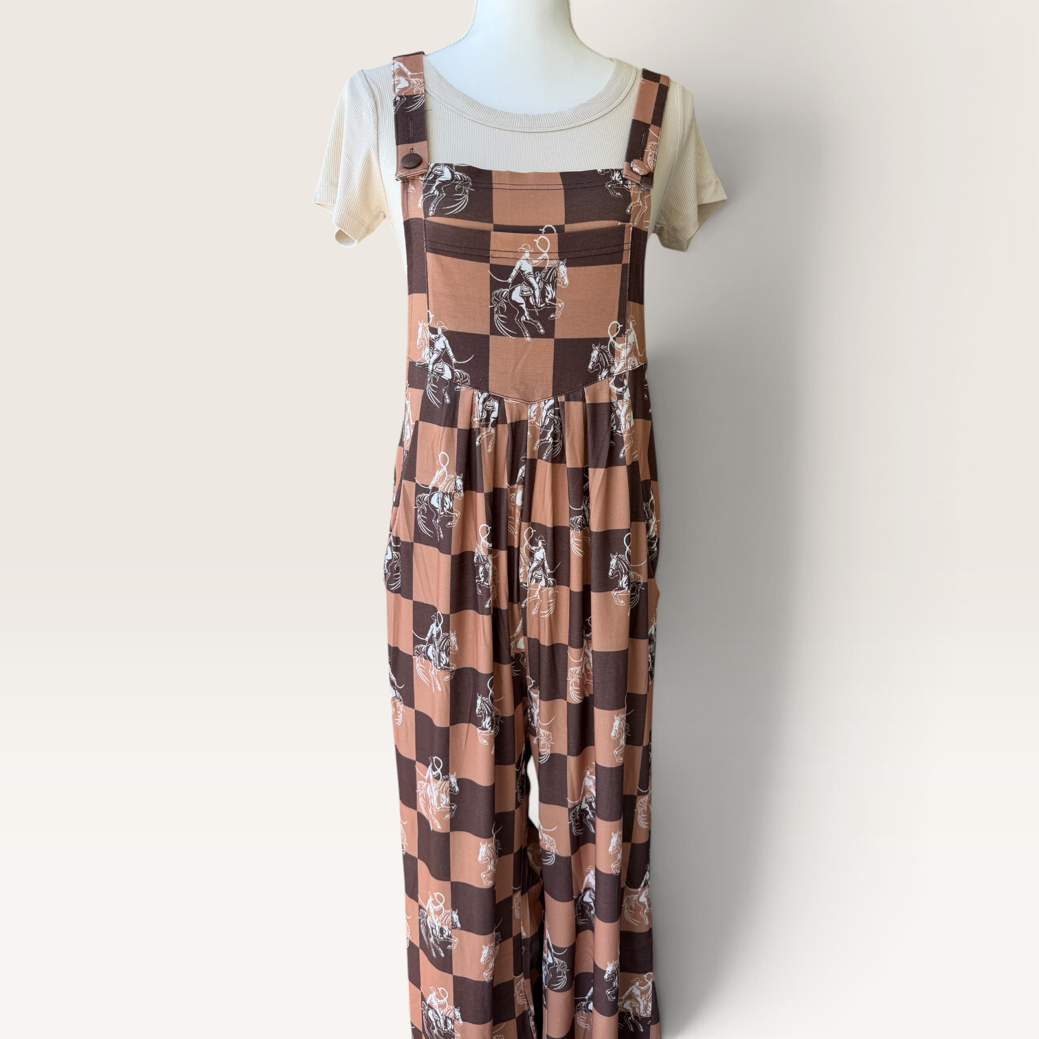 Front view of western checkerboard overalls with horse print