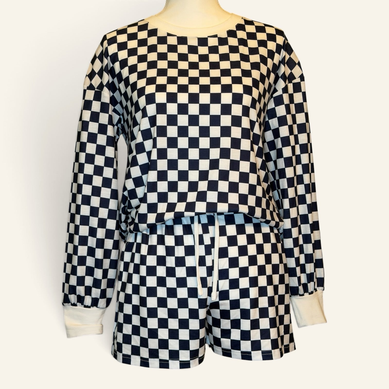 Navy and white checkered two-piece set with long-sleeve top and shorts
