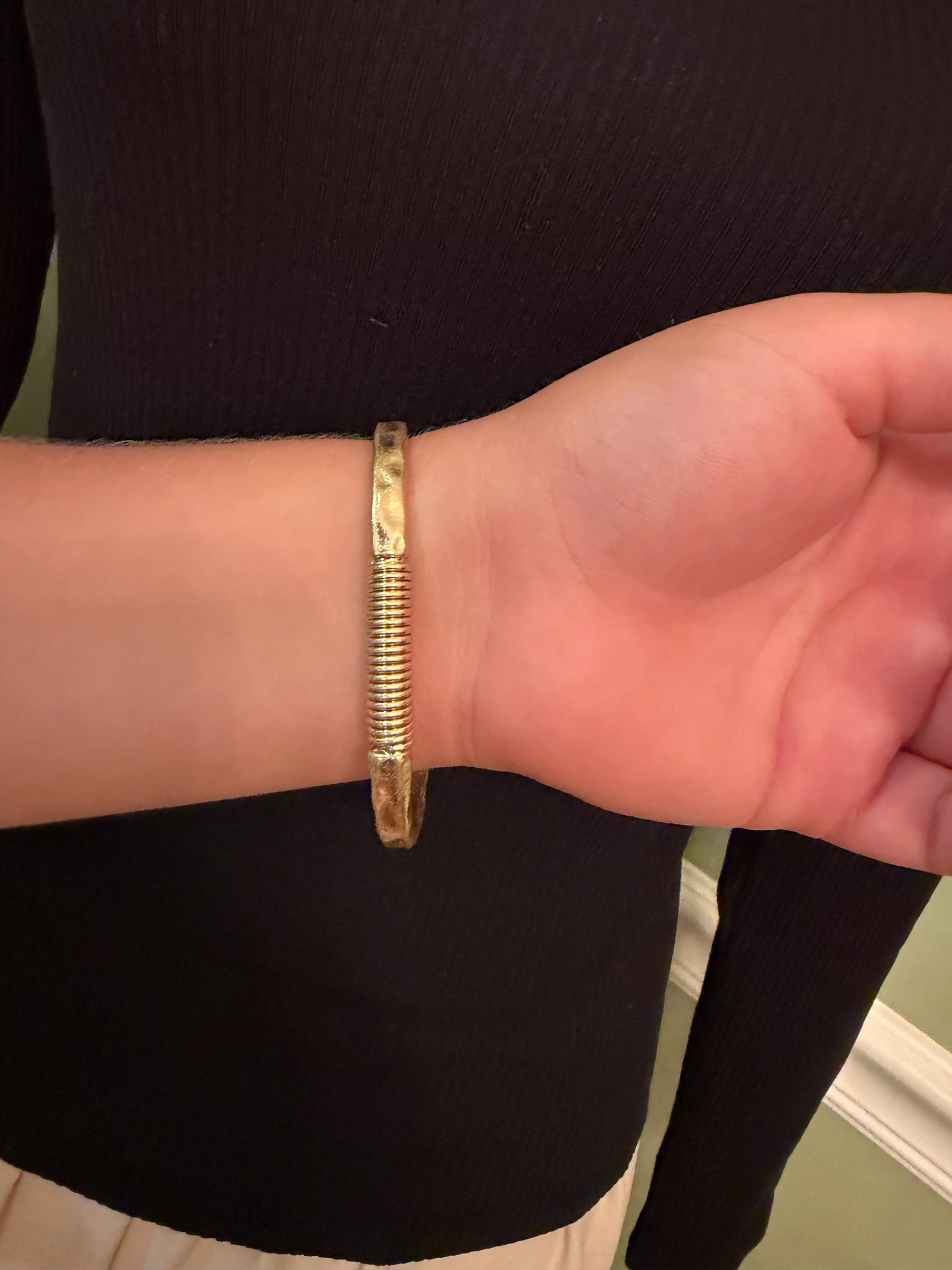 Coordinating cross bracelet shown on wrist
