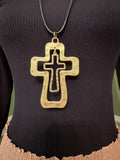 Layered cross necklace with silver-tone and gold-tone details