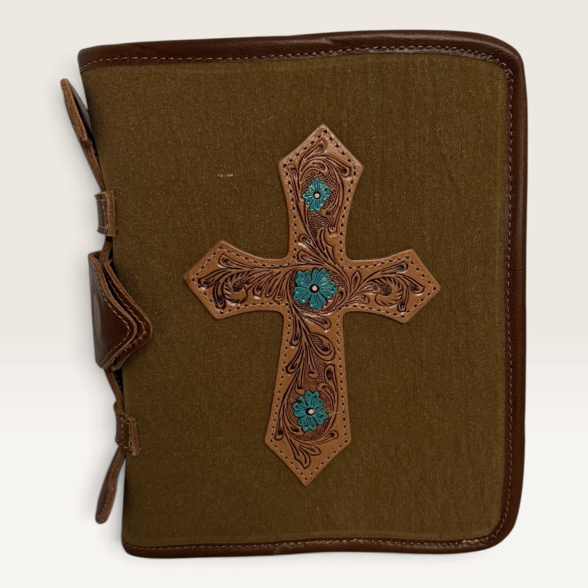 Western Bible cover in olive and brown cotton with leather trim and hand-tooled leather cross with turquoise floral accents
